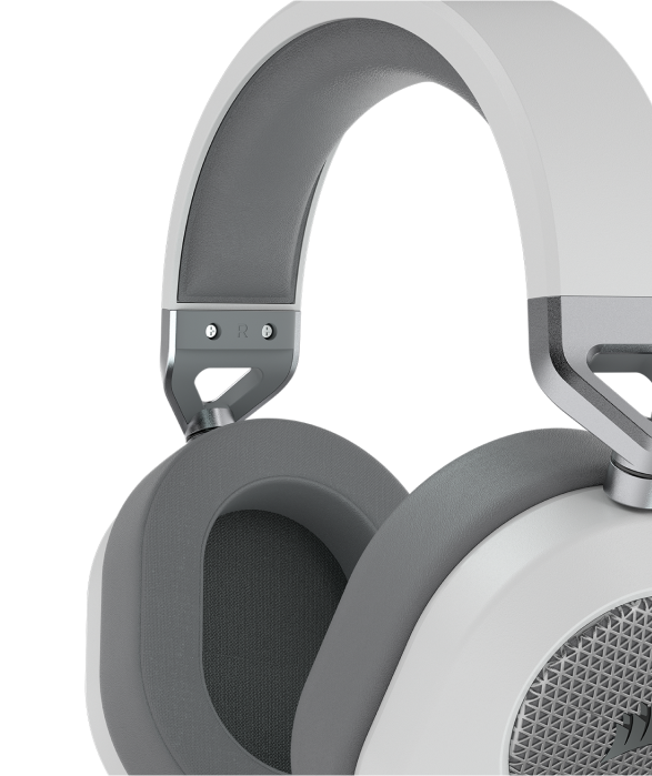 Close up of HS65 SURROUND wired gaming headset showing the breathable soft memory foam earpads.