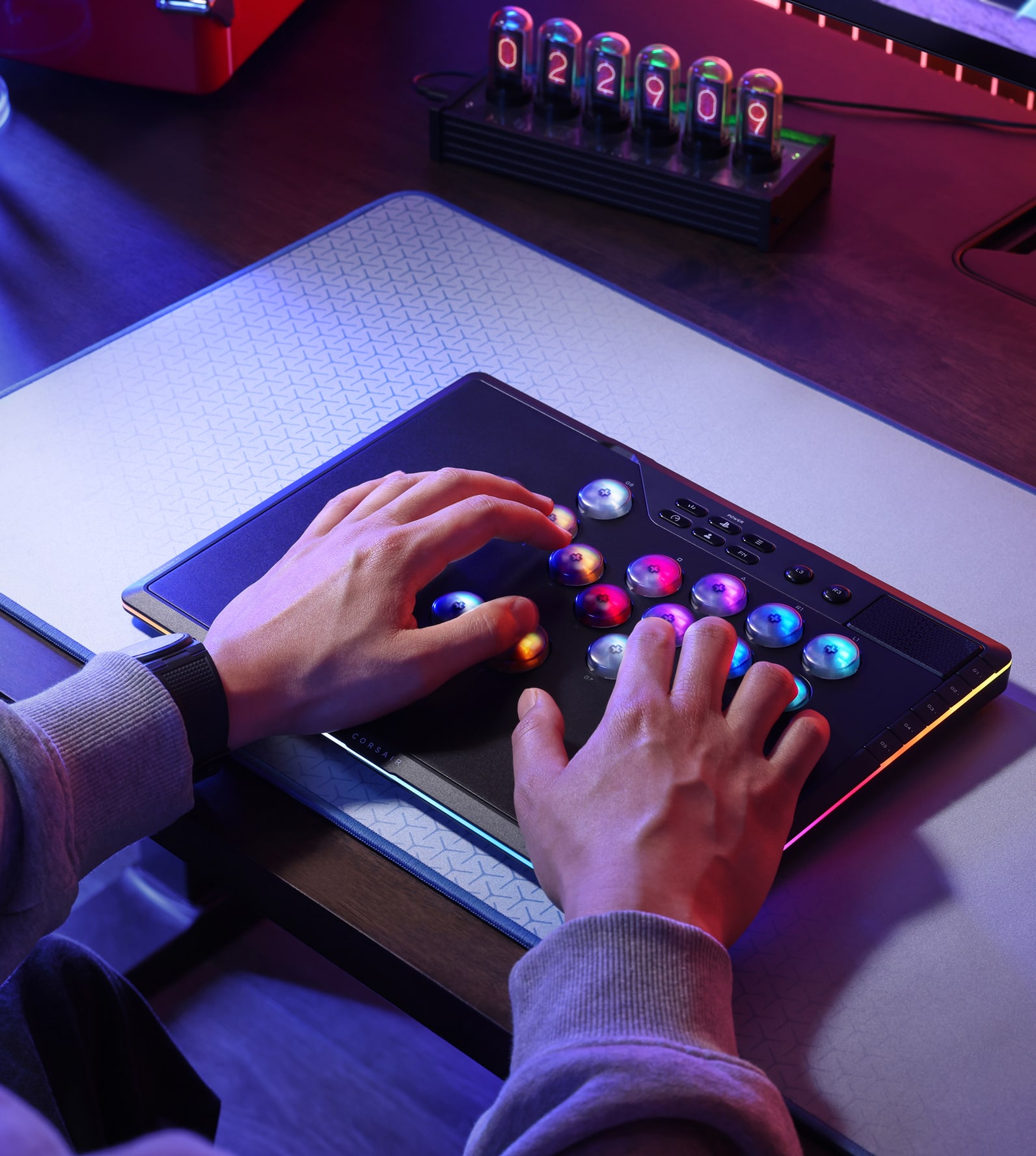 CORSAIR Novablade arcade fighting controller with RGB-illuminated buttons used in Game Mode on a desk.