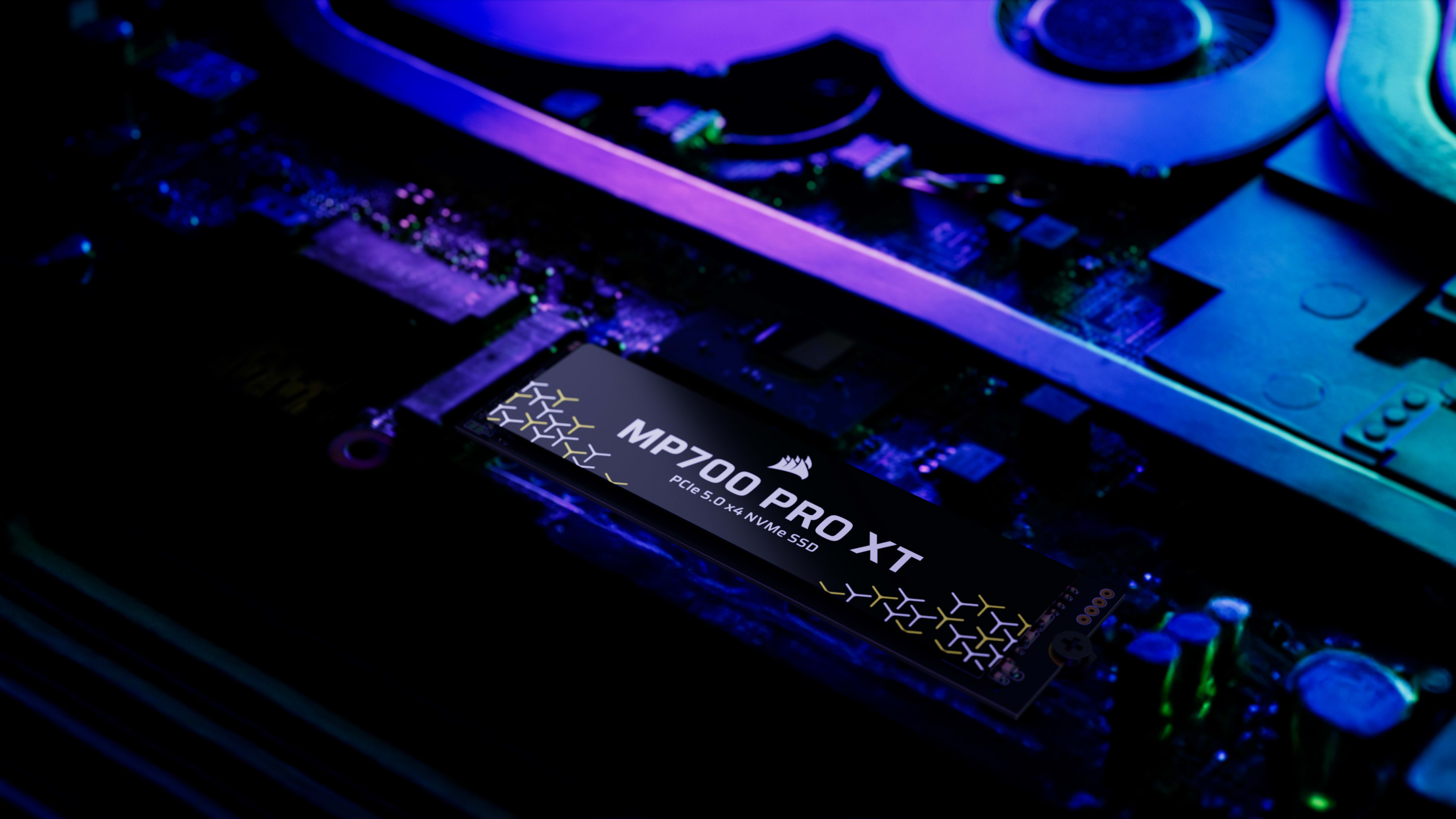 CORSAIR MP700 PRO XT SSD seated in a PC M.2 slot with purple and blue RGB accent lighting inside the case.