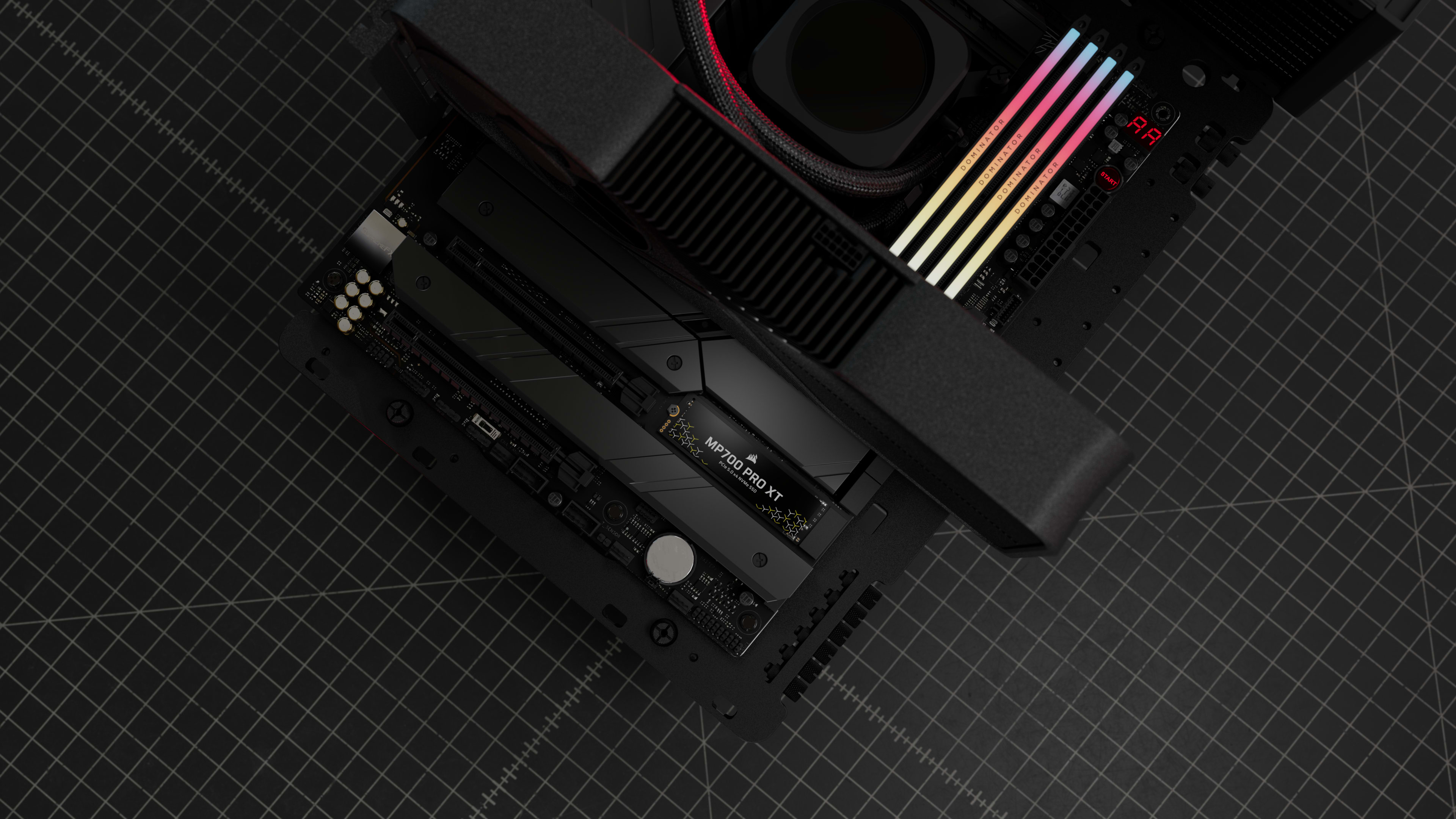 CORSAIR MP700 PRO XT M.2 SSD seated on a motherboard with heatsink, RGB RAM, and liquid cooler shown from above.