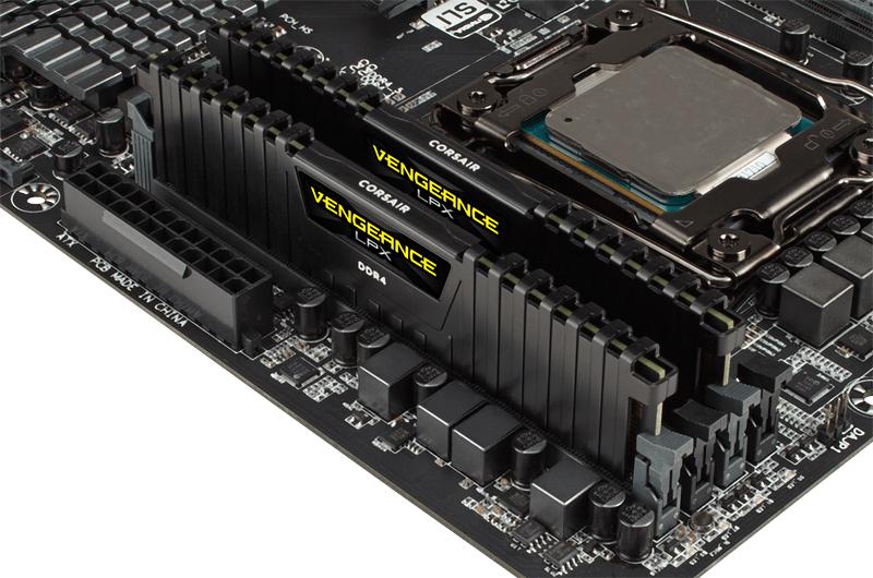 Two CORSAIR VENGEANCE LPX black DDR4 memory modules installed in a motherboard for overclocking performance.