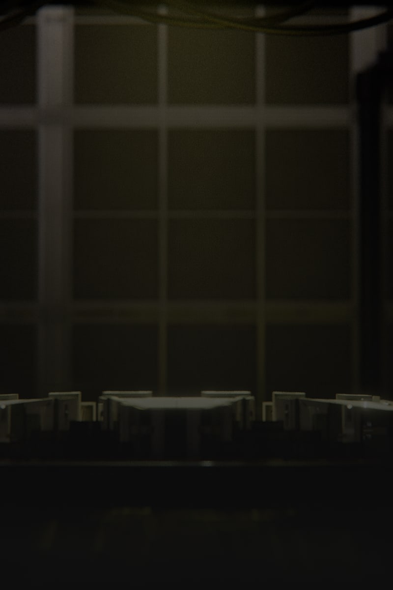 Dramatic close-up of PC server rack interior components shot in low light against a dark background.
