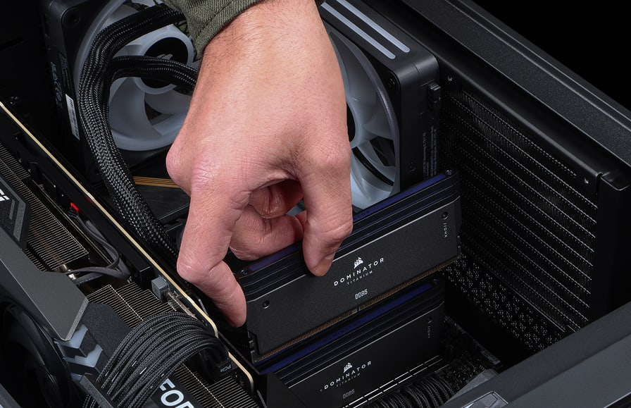 Hand placing memory in motherboard
