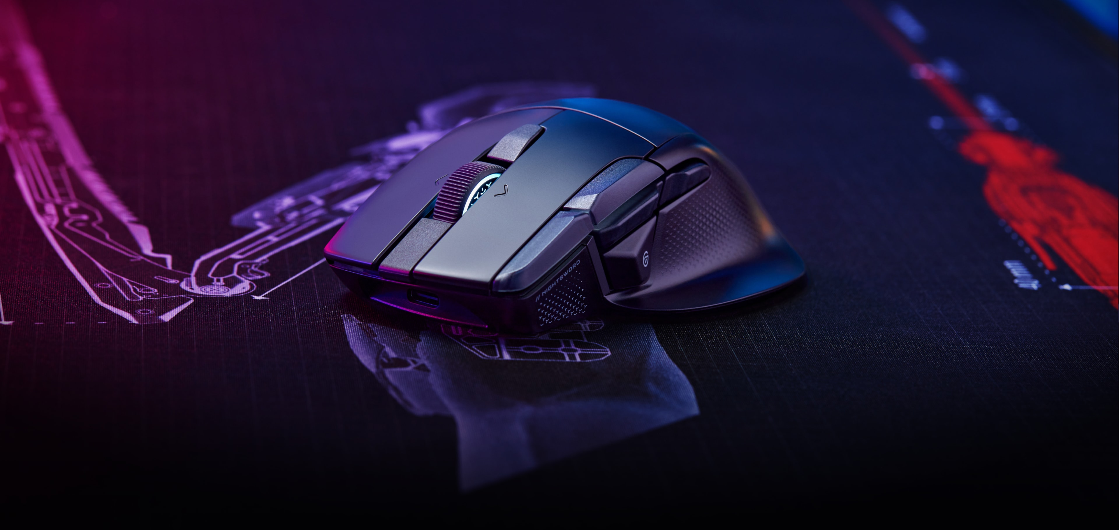 The CORSAIR NIGHTSWORD v2 WIRELESS on a purple/blue deskmat.